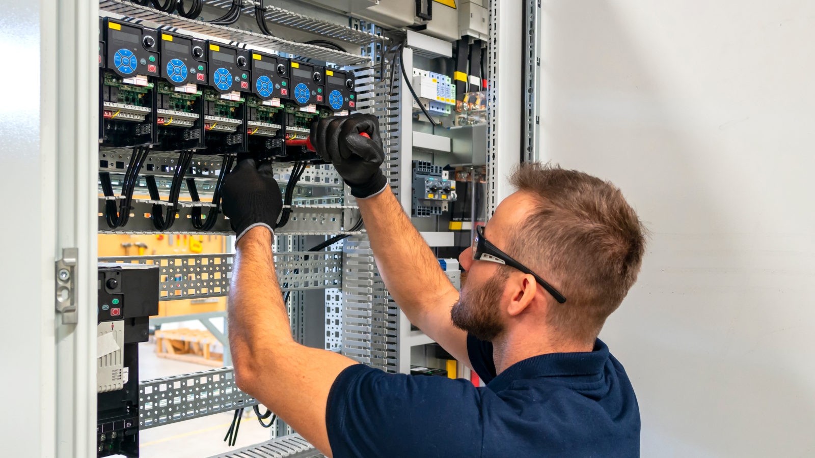 An Expert Looking Working on An Electric Panel